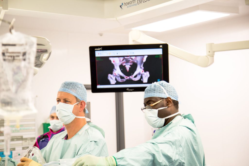 surgeons performing hip arthroscopy